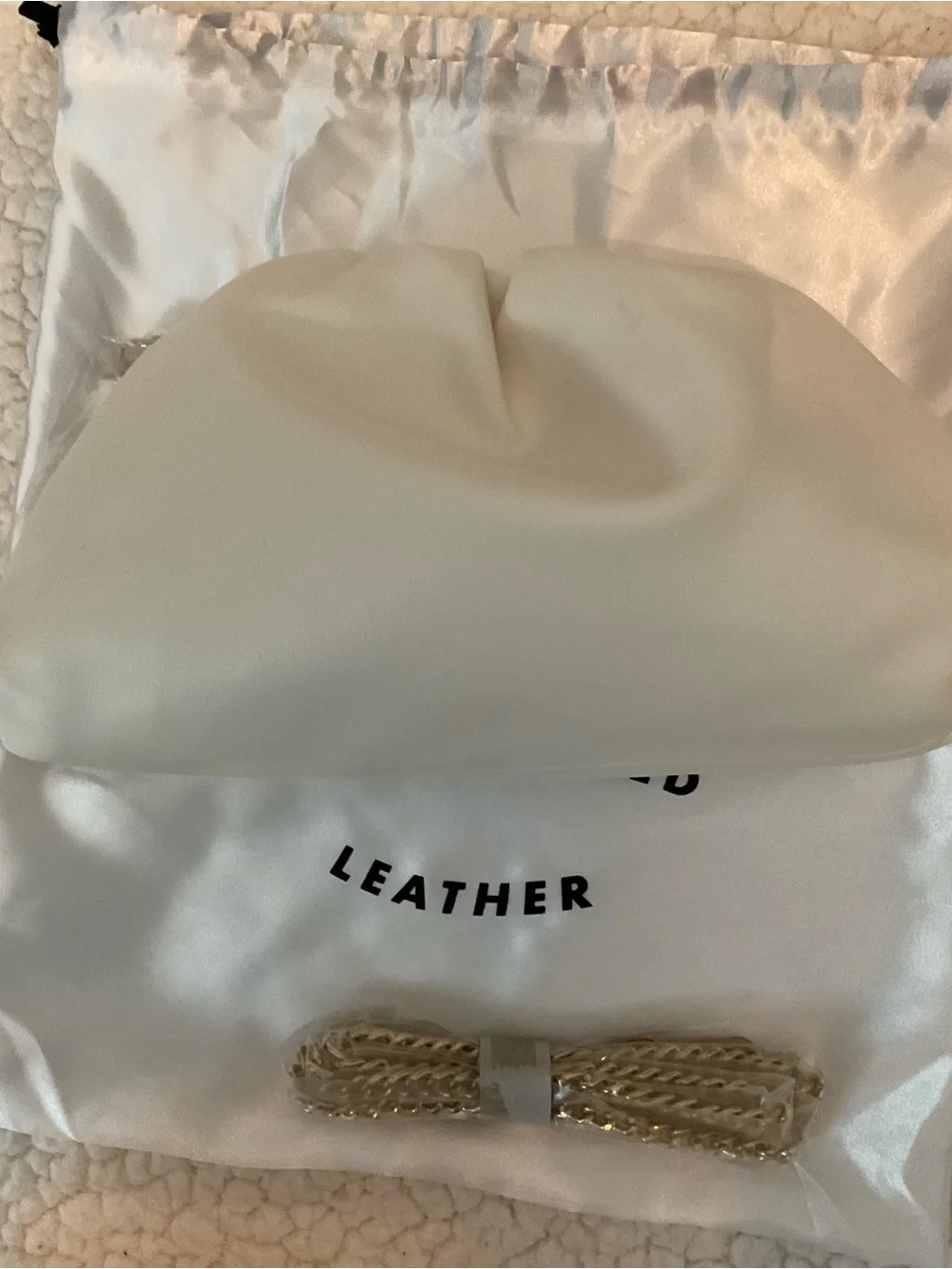 Understated Leather crescent cream